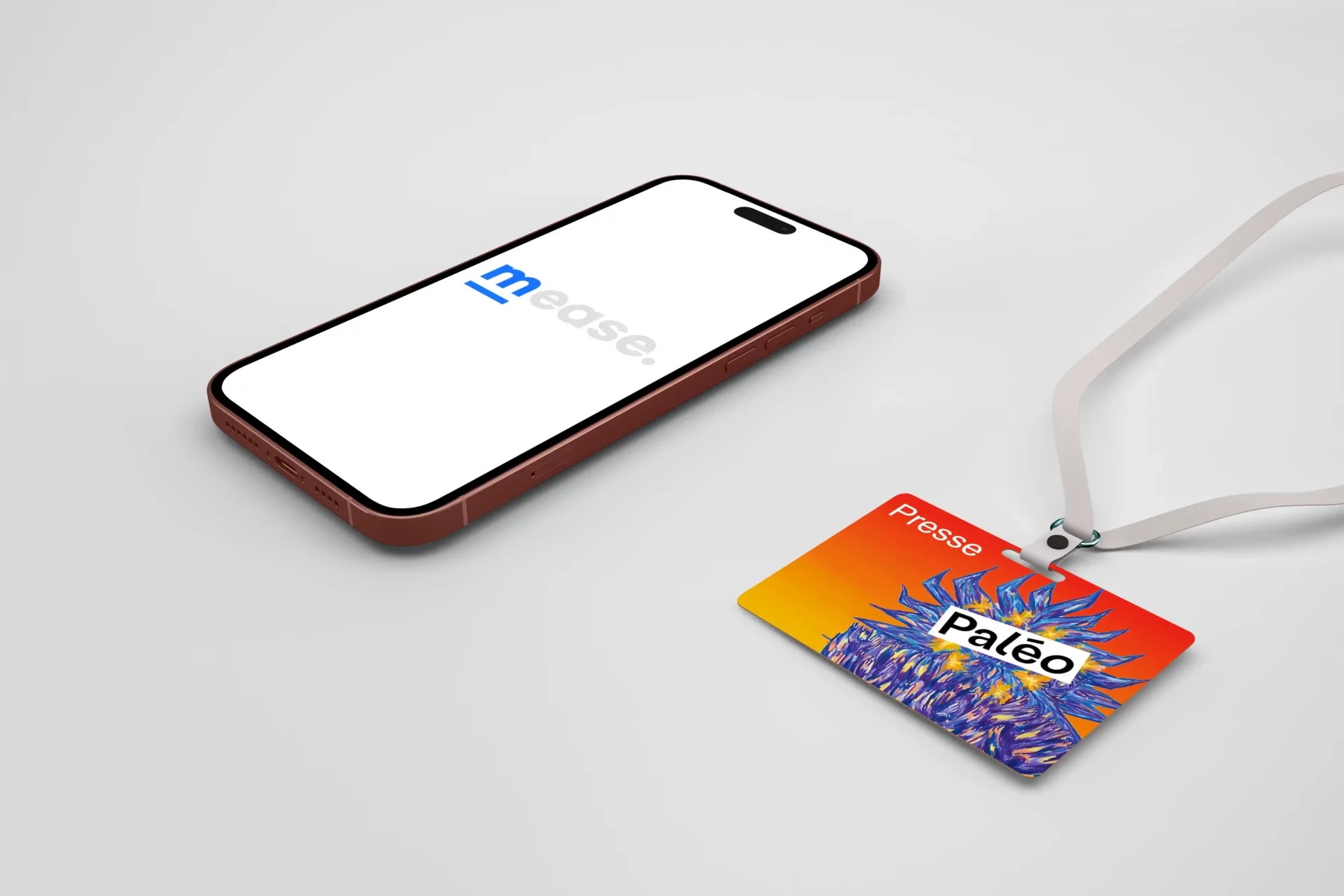 Smartphone qui fait tourner Mease avec un badge de presse Paléo